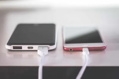 Portable solar panel charger unfolded in sunlight