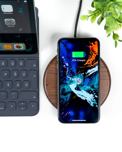 Solar phone charger connected to a smartphone outdoors