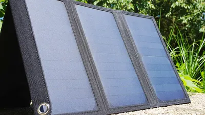 Compact solar travel charger in a backpack pocket