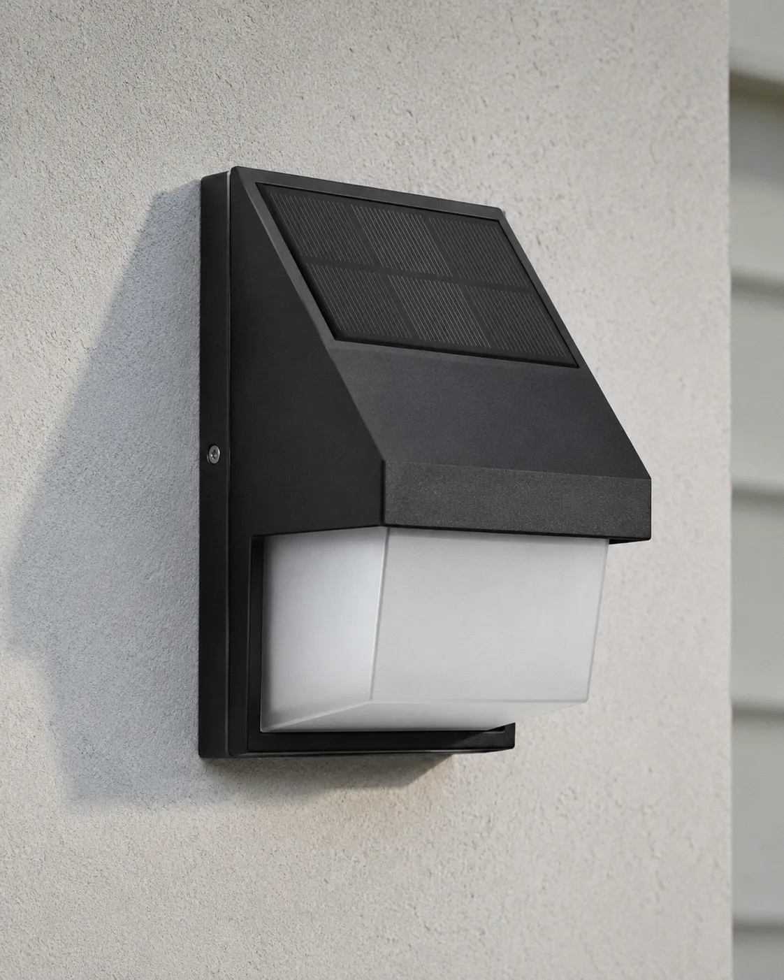 Premium die-cast aluminum solar wall light with matte black finish and frosted lens mounted on a light grey exterior house wall in natural daylight
