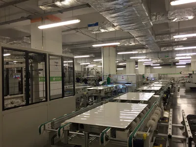Solar panel manufacturing process in a factory