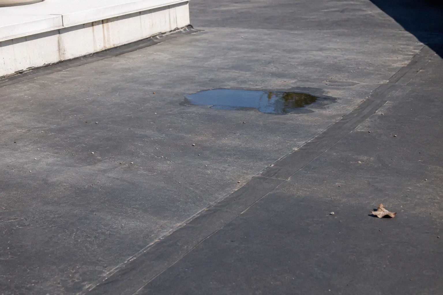 Close-up of EPDM rubber roofing membrane on a flat residential building