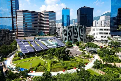 Solar panels on a roof with financial charts overlay