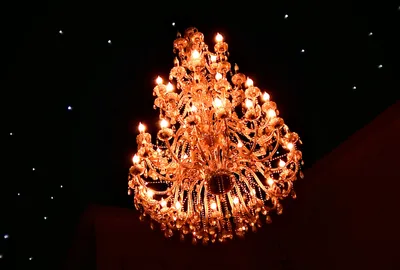 Outdoor solar chandelier hanging in a gazebo
