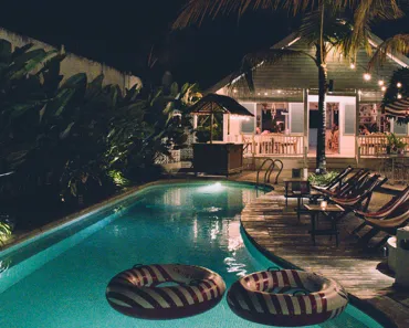 Solar floating pool lights glowing in a swimming pool