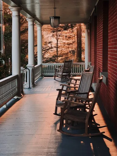 Solar porch light illuminating a front door entrance