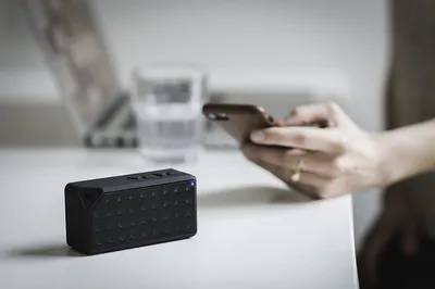 Solar-powered Bluetooth speaker on a picnic table