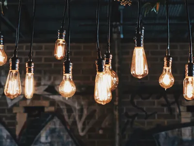 Vintage-style solar lamp glowing on a front porch