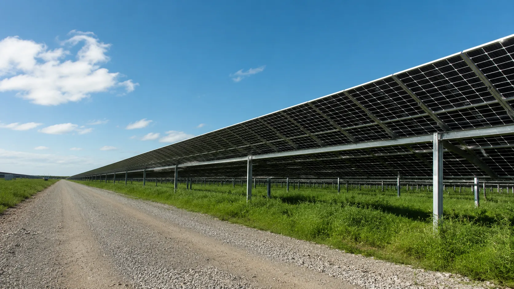 Solar panels being installed on a commercial rooftop by a professional installation crew