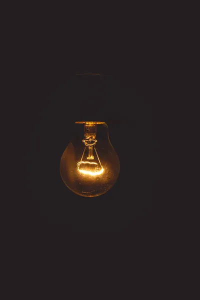 Person troubleshooting a non-working solar garden light