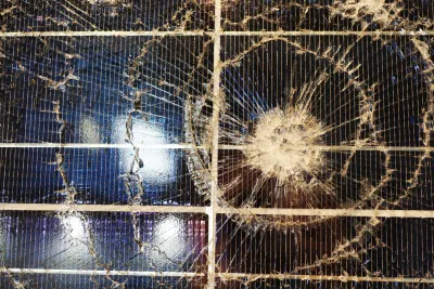 Dim solar light being inspected for battery issues