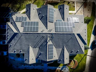 Homeowner reviewing solar panel installation costs and ROI calculations
